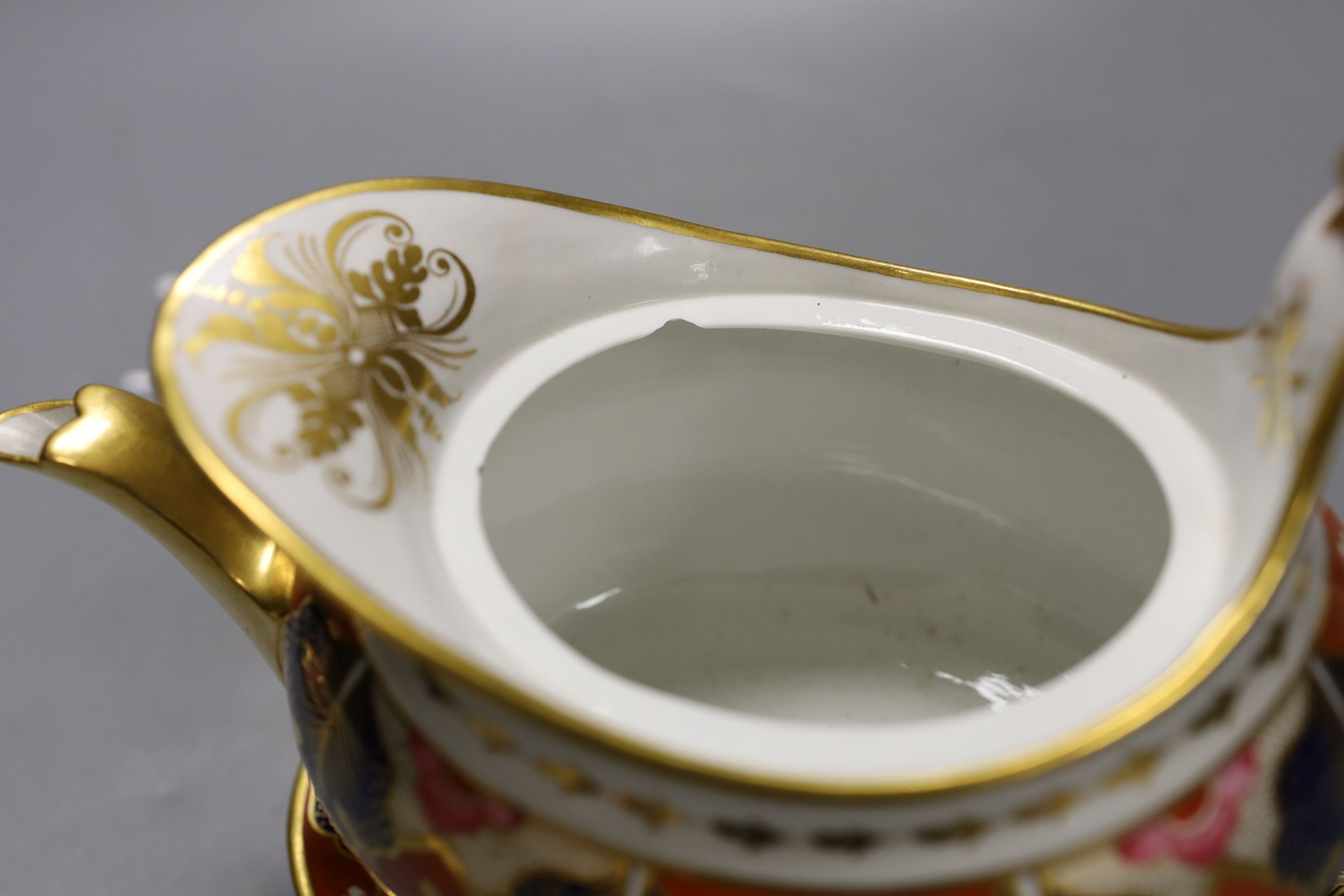 A Barr Flight and Barr Worcester teapot cover and stand painted with an Imari pattern, c.1805, 23 cm long